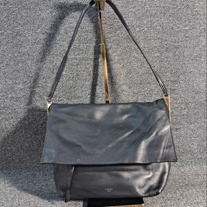 Celine Flap Clasp bag in black calfskin leather.